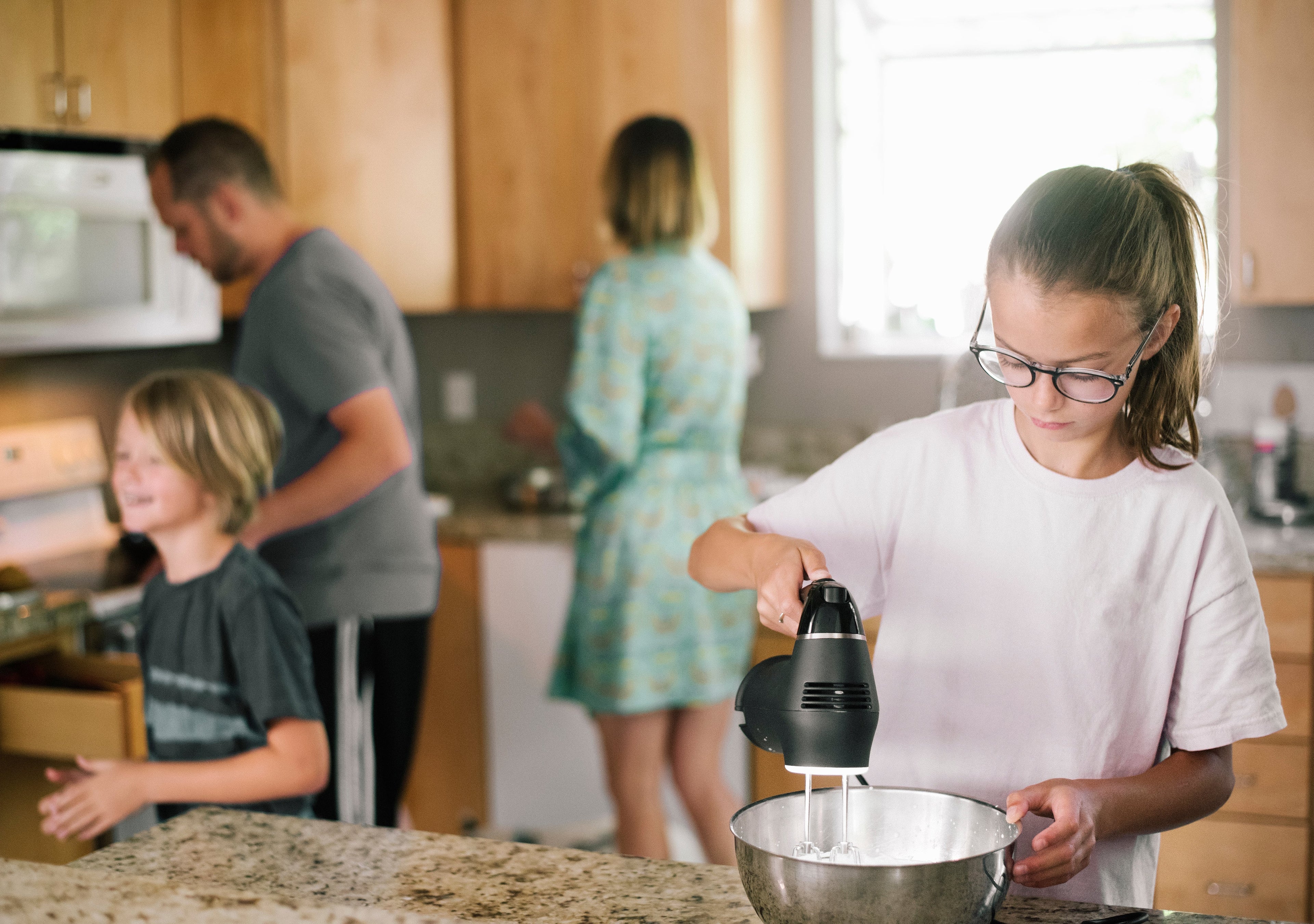 Family preparing breakfast together during a calm morning routine.